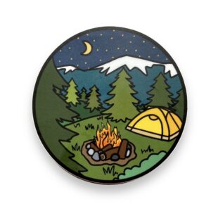 Circle sticker with yellow tent in forest with campfire