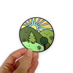 smiling trees, hills, and sun in a circle sticker