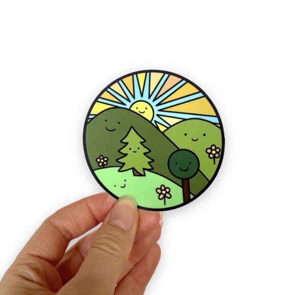 smiling trees, hills, and sun in a circle sticker